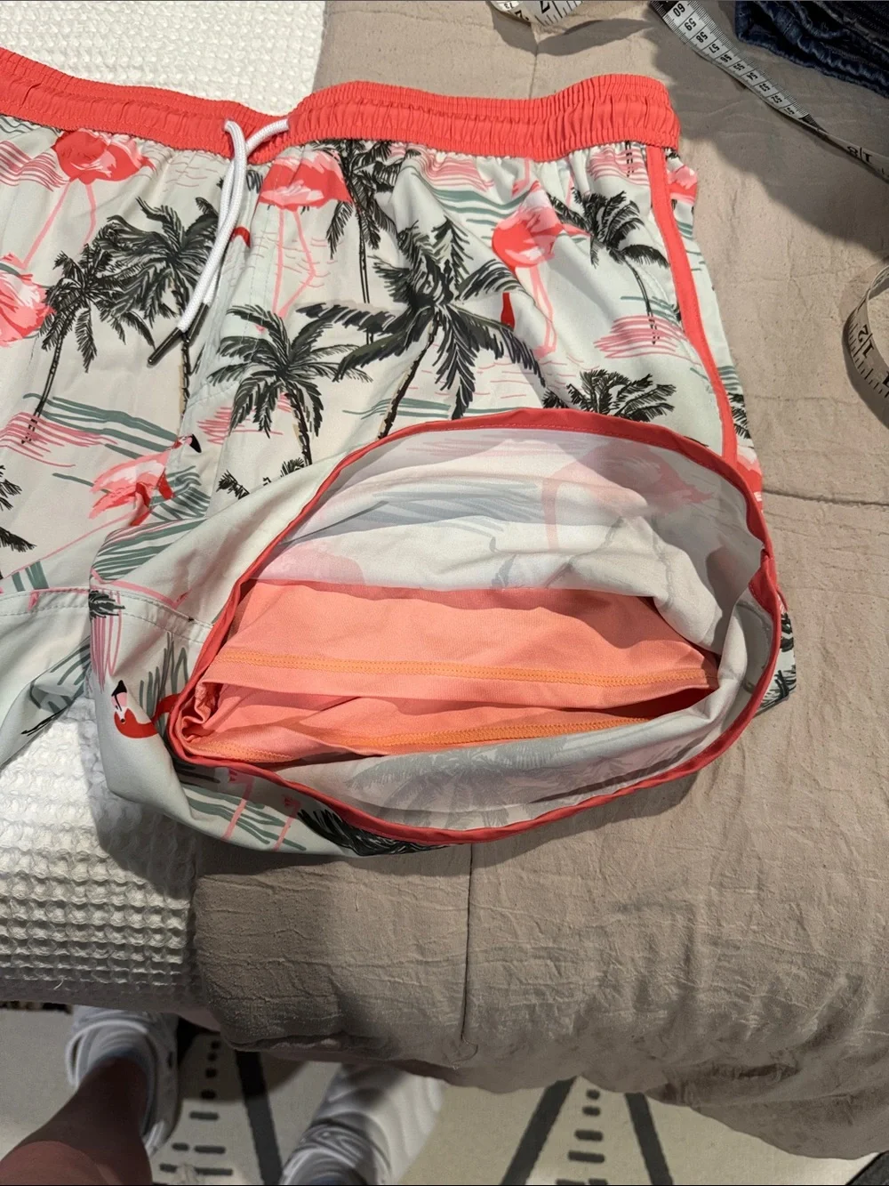 Maamgic flamingo print swim trunks feature a vintage 80s-90s style with a contra